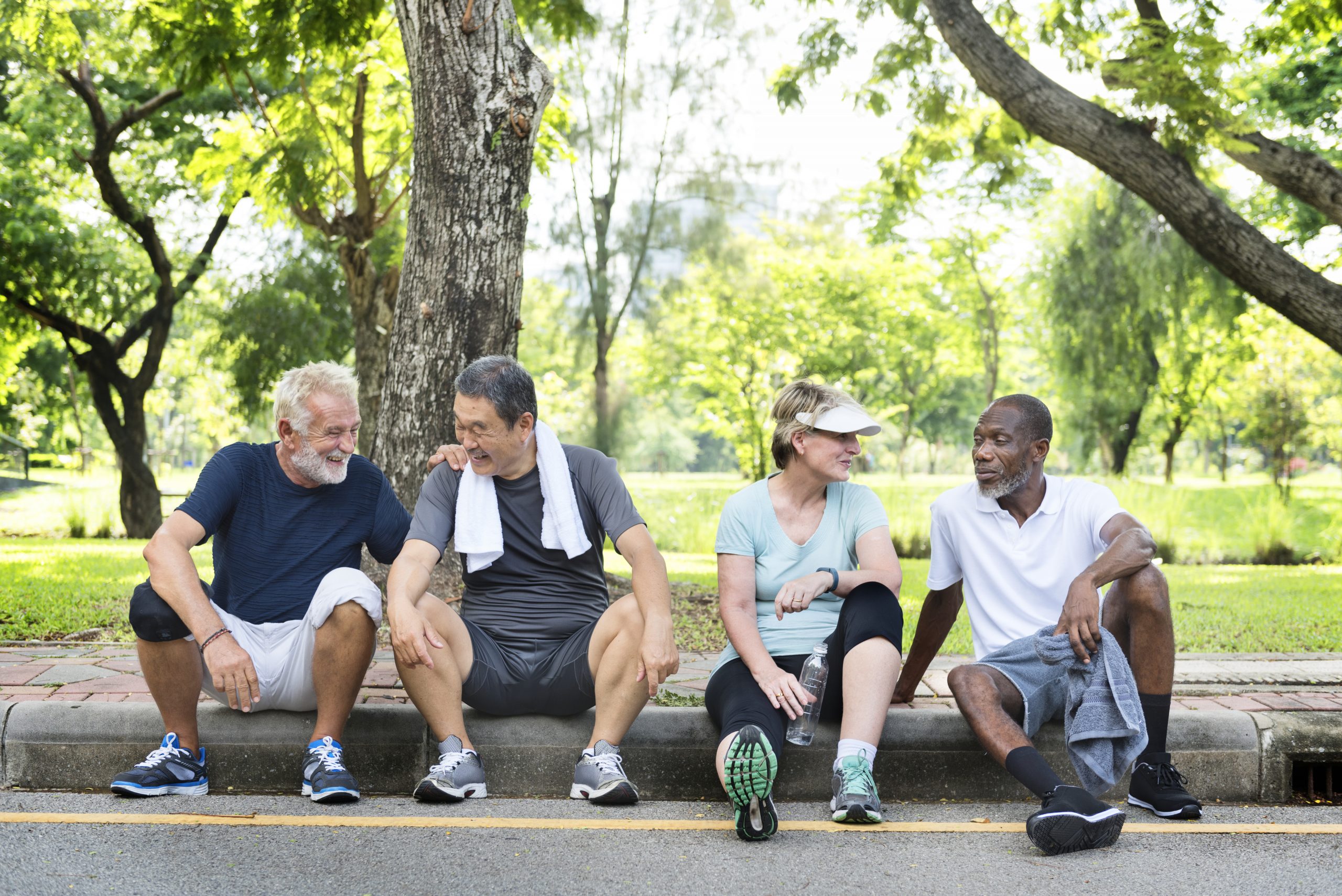 Group of senior friends relaxing together after an excercise Group of senior friends relaxing together after an excercise